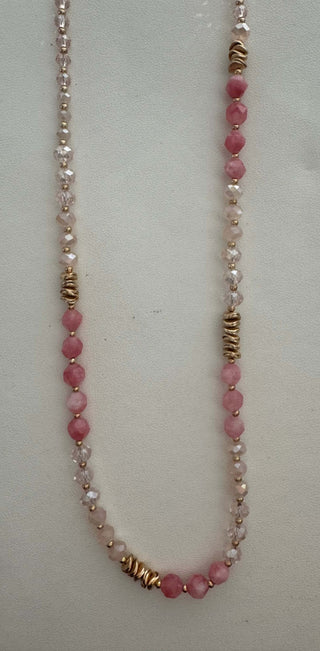 Elegant pink faceted necklace with gold beads and crystal accents, perfect for enhancing any outfit with a touch of sparkle.