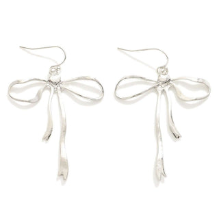 Elegant silver bow drop earrings with intricate design, perfect for adding a touch of sophistication to any outfit.