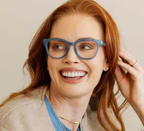 Alt text: "Nola Denim Blue Readers by Peepers – stylish blue reading glasses with a sleek, modern design.