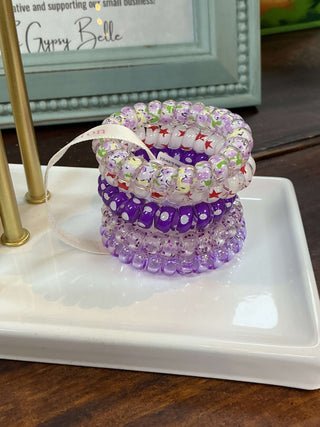 Image of Simply Southern Lavender Coil Hair Ties, featuring a set of spiral, lavender-colored hair accessories on a white background.