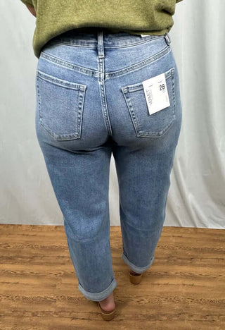 Vervet V3598 Med Wash Super High Rise Barrel Jeans displayed on a hanger showcasing stylish design and classic blue hue.