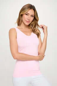 Pink buttery soft reversible seamless tank top on hanger, perfect for versatile, comfortable everyday wear.