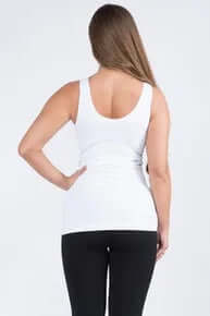 White buttery soft reversible seamless tank top for women, showcasing minimalistic and comfortable design in a neutral setting.