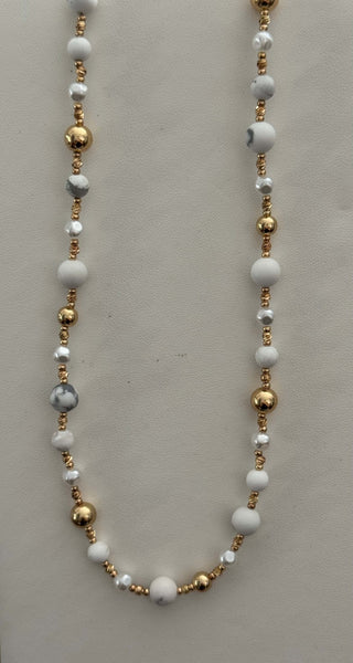 Elegant gold, pearl, and white marble beaded necklace with a stylish gemstone design, perfect for any occasion.