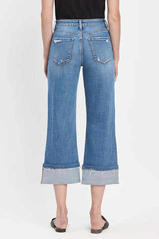 Lovervet V3593 distressed wide-leg cuff crop jeans in medium blue denim with subtle rips and a modern, relaxed fit.