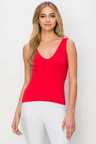 Red buttery soft reversible seamless tank top displayed on a hanger, showcasing its comfortable and versatile design.