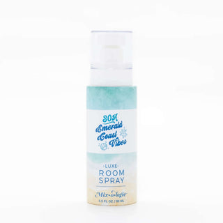 Elegant brown glass bottle of AMI Emerald Coast Mixologie Large Room Spray with a gold cap, perfect for refreshing any space.