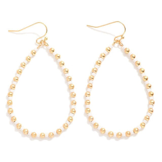 White & Gold Beaded Teardrop Earrings on Display, Handcrafted with Elegant Beads, Ideal for Stylish and Sophisticated Looks.