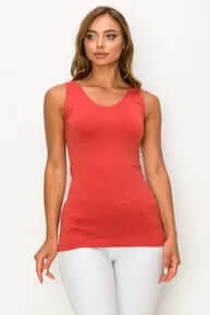 Model wearing BURNT SIENNA Buttery Soft Reversible Seamless Tank, showcasing its sleek design and rich color.