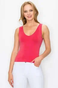 Fuschia cropped buttery soft reversible seamless tank top displayed on a hanger against a neutral background.