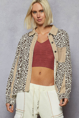 Leopard print shacket with latte trim, featuring a relaxed fit and button-down front