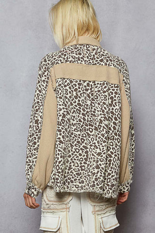 Leopard print shacket with latte trim, featuring a relaxed fit and button-up front