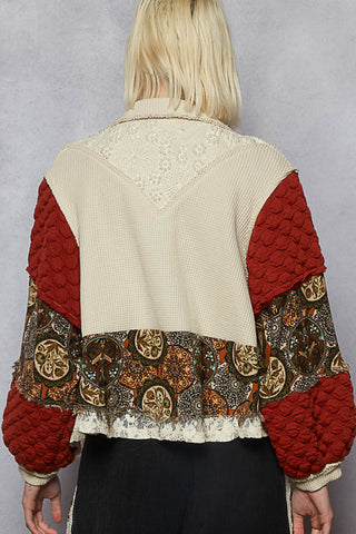 Deep brick and oatmeal shacket with pearl accents, featuring a relaxed fit and stylish design.