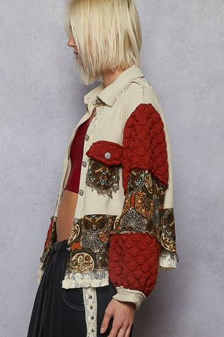 Deep brick and oatmeal shacket with pearl accents, featuring a stylish, relaxed fit and button closure.