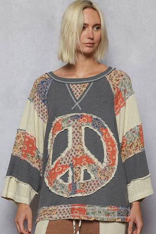 Charcoal long sleeve top with patchwork design and a relaxed fit