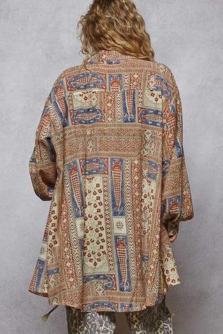 Taupe patchwork print long sleeve duster top featuring rust and blue accents