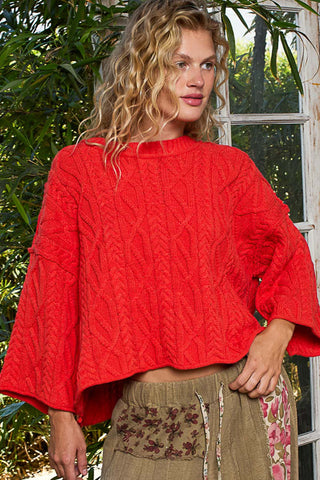 Oversized round neck cable knit sweater in soft cream, perfect for cozy layering in cooler weather