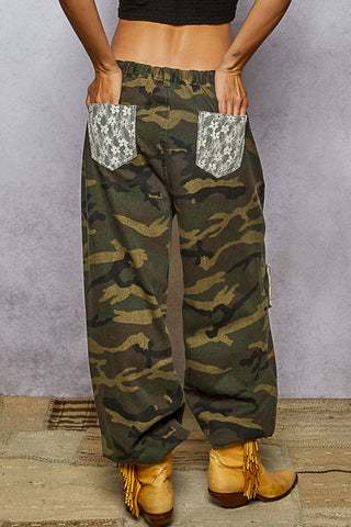 Olive camo joggers with lace patchwork detailing and a relaxed fit