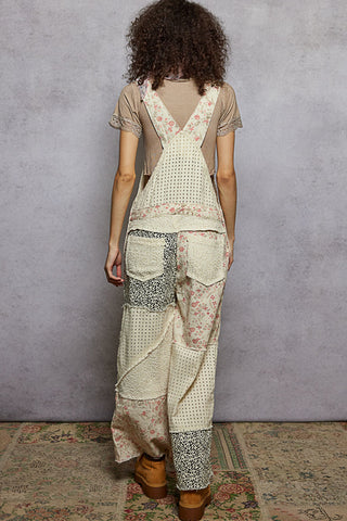 Cream twill overalls featuring a floral and animal print design, perfect for a stylish, casual look