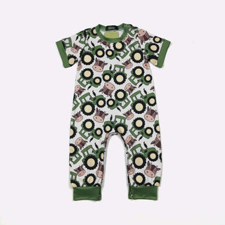 Adorable Green Tractor Boy Romper with vibrant print, perfect for playful comfort and style in soft, breathable fabric.