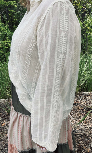 Ivory long-sleeve embroidered button-down top by Adora, featuring elegant detailing and a chic, versatile design.