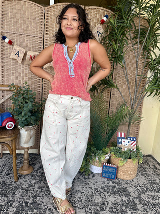 Ivory pants with coral polka dots and white gypsy fit waistband detail.
