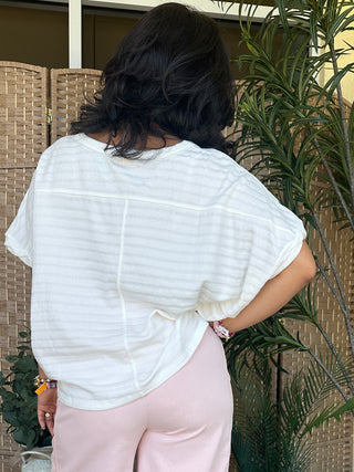 White textured dolman short-sleeve top with relaxed fit, back view.
