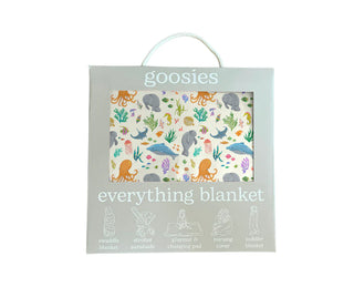 Colorful ocean animals and plants printed on cream everything blanket packaging by Goosies.
