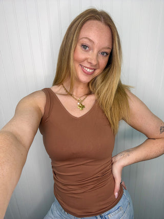 Mocha buttery soft reversible seamless tank with v-neckline on model.
