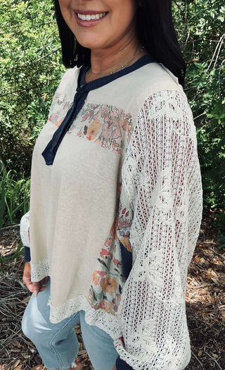Women's POL Coconut Crochet Sleeve Jersey Top with stylish navy detail and intricate crochet accents. Perfect for casual chic.