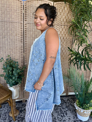Light blue chambray sleeveless tank top with embroidered eyelet details, oversized fit.
