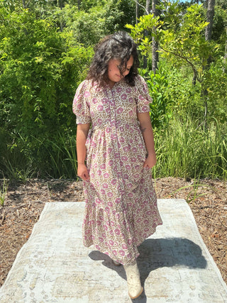 Orchid floral midi dress with button front and scallop trim, featuring a fitted bodice and flowing skirt