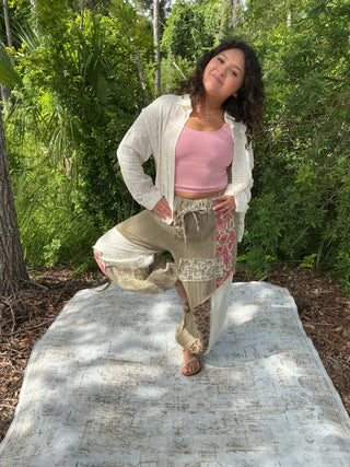 Ivory jogger pants with embroidered details and patchwork accents in an oversized fit