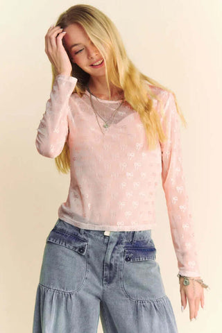 A stylish Pink Bows Long Sleeve Layer Top with delicate bow details, ideal for a chic and trendy look.