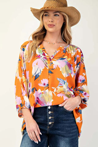 FINAL SALE Easel Orange Tropical Floral Top with vibrant patterns, ideal for summer fashion.