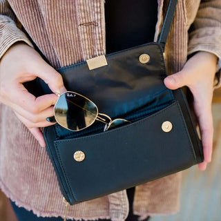 STG Captiva Sunglasses Holder and Touch Screen Purse in various colors, featuring versatile design for stylish organization.