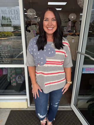 Heather Grey Americana Flag Top by Easel displayed on hanger, FINAL SALE. Casual, stylish, and perfect for any relaxed occasion.