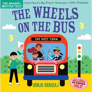 Colorful children's board book cover featuring a red bus with cartoon characters and children in a street scene with clouds a
