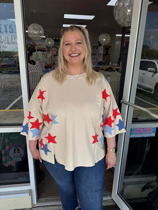 Stylish natural 3/4 sleeve top with a star patch design, perfect for a trendy look. Final sale, shop now!