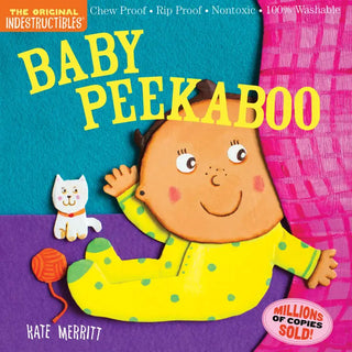 Colorful board book cover featuring smiling baby character in yellow outfit with small white cat toy and orange ball on blue
