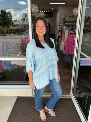 Light blue V-neck oversized top by Oli & Hali, crafted from mix fabric, styled with casual elegance.
