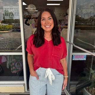 Red mineral washed cap sleeve pocket top on final sale, showcasing casual style and comfort.