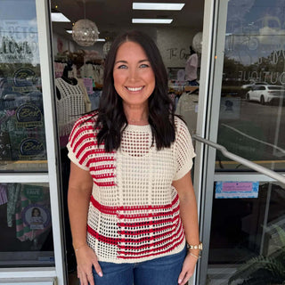 Red and cream open weave block crochet top on hanger; stylish and breathable design, perfect for warm weather. Final sale item.