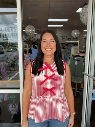 Stylish red seersucker peplum top featuring a charming bow front, perfect for a chic summer look.
