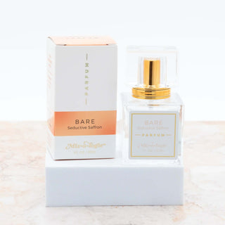 BARE Mixologie Parfum Spray bottle with minimalist design on a soft beige background, exuding elegance and sophistication.