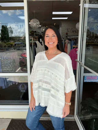 Ivory Mix Fabric V Neck Oversized Top by Oli & Hali, stylishly draped on a mannequin, highlighting its casual elegance.