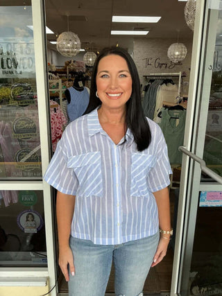 Powder blue & white stripe button-down top on hanger, final sale, crisp cotton fabric, perfect for casual or office wear.
