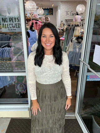 Cream floral lace layering top by Davi & Dani, showcasing delicate lace details and elegant long sleeves against a white backdrop.