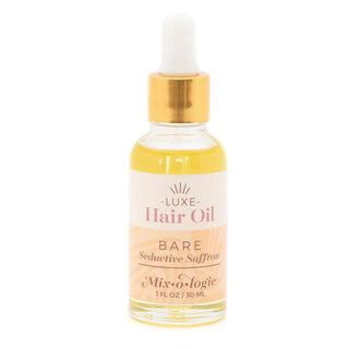 BARE Mixologie Luxe Hair Oil bottle on white background with sleek black and gold design for premium hair care.
