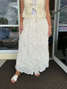 Alt text: "Boho Ecru Lace Wavy Ruffle Maxi Skirt - Elegant, flowy design for a chic, stylish look.